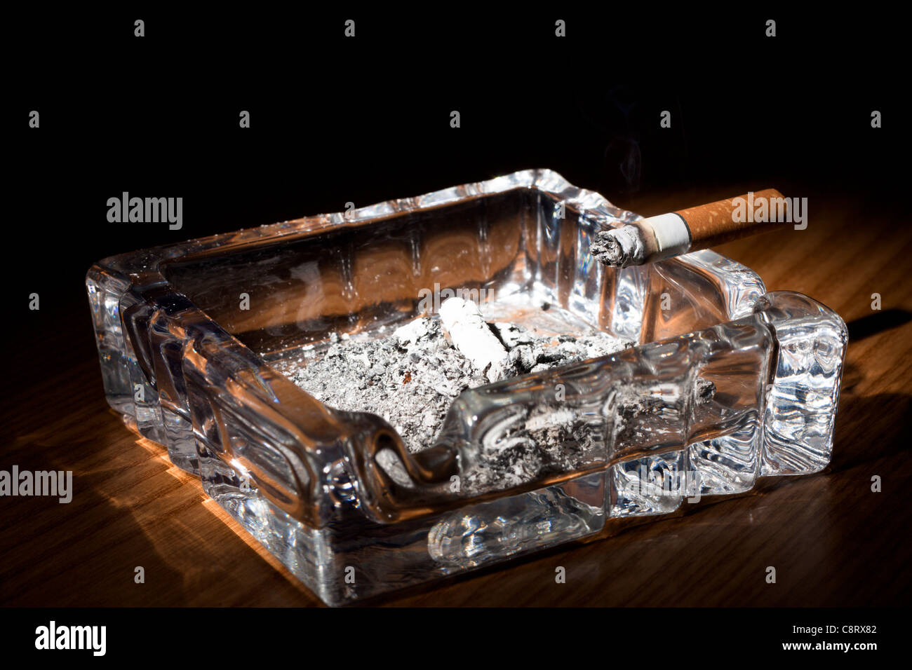 Glass Ashtray with Cigarette Stock Photo Alamy