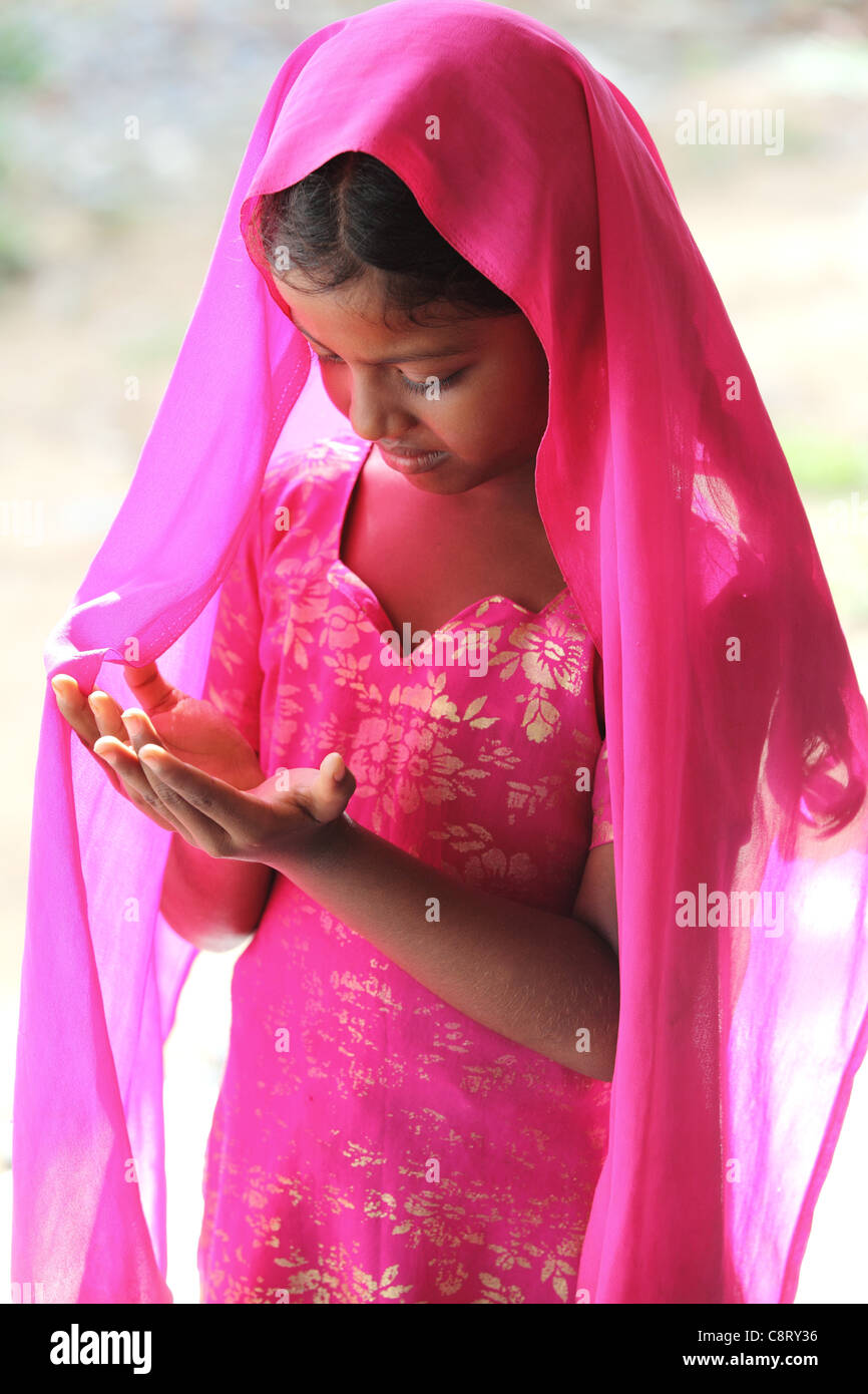 Muslim girl in prayer Andhra Pradesh South India Stock Photo