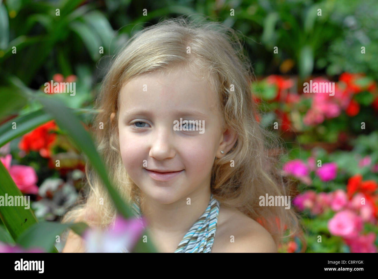 child girl portrait in the flowers Stock Photo