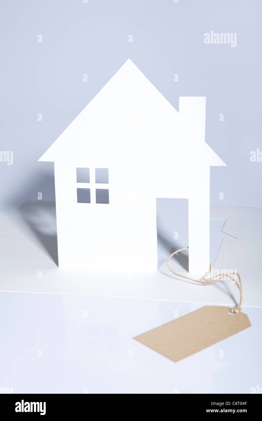 House Model With Tag And White Background Stock Photo