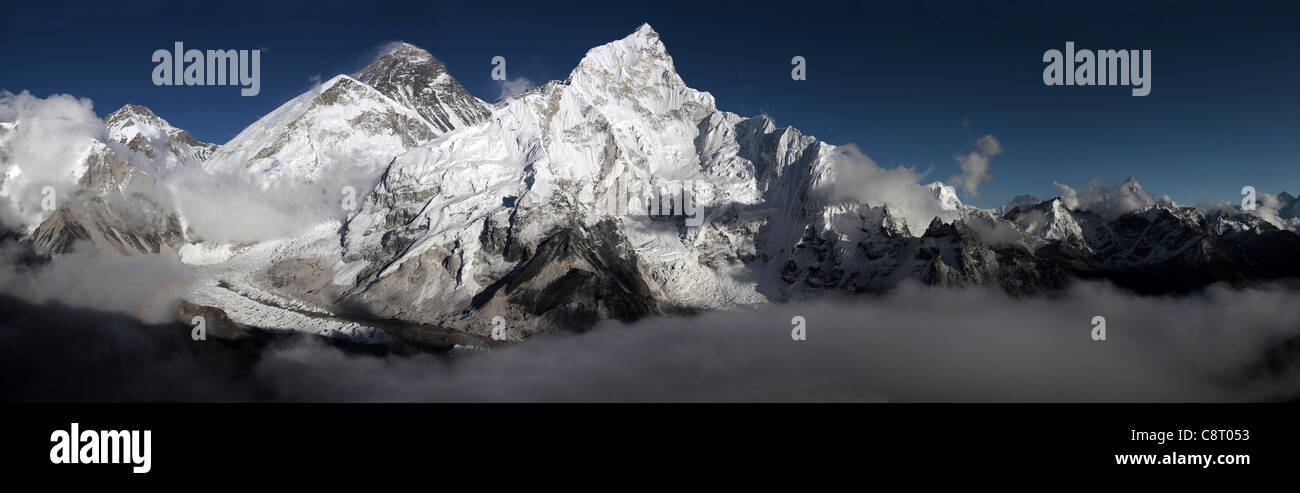 Everest Range Himalayas - Everest is peak to the left of picture with snow blowing off top Stock Photo