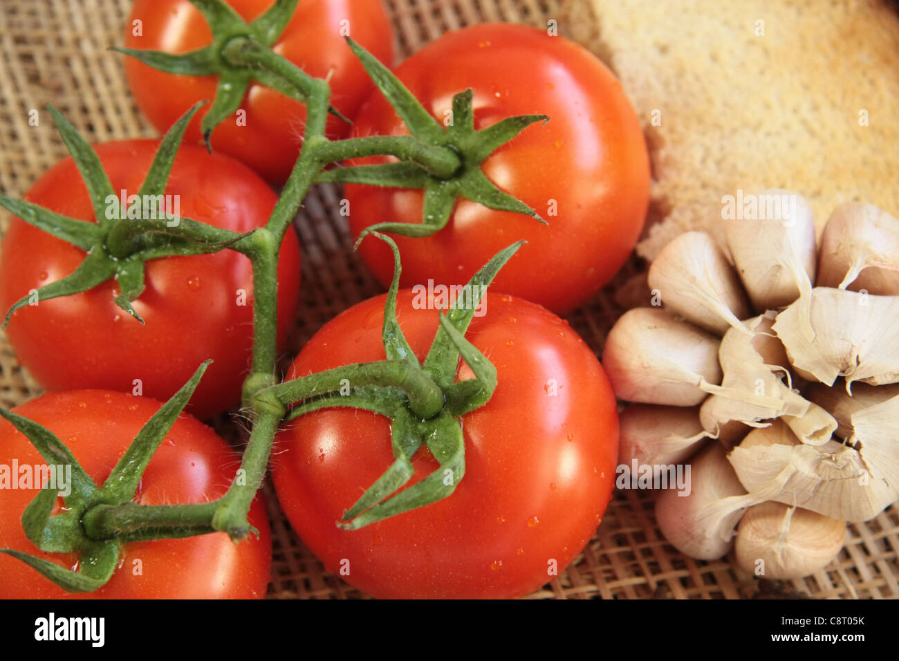 tomatoes with garlic and bread Stock Photo