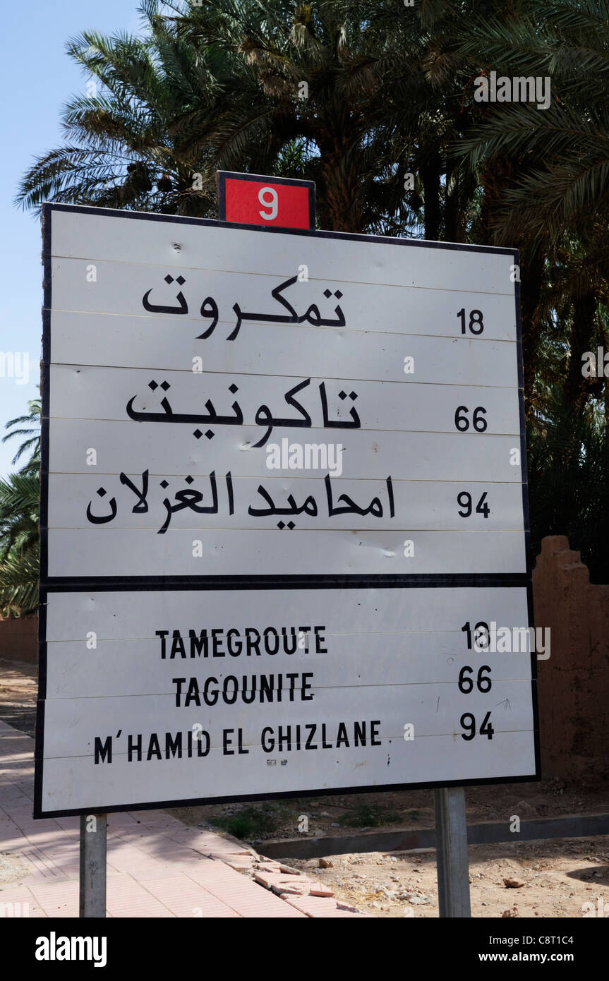 Bilingual Road Sign in Zagora, Draa Valley Region, Morocco Stock Photo
