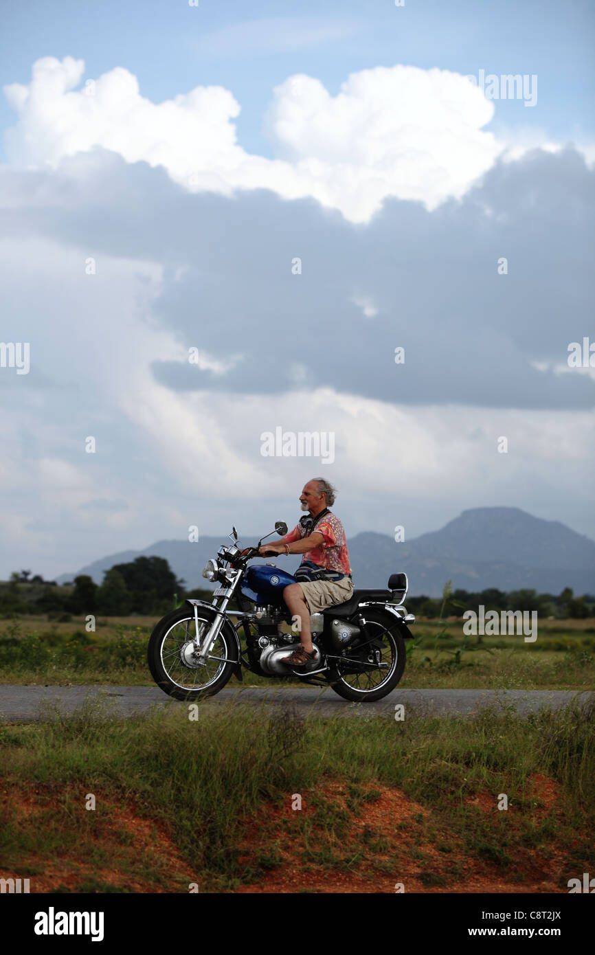 Bullet Driving European man driving a Bullet Enfield in Andhra Pradesh South India ...