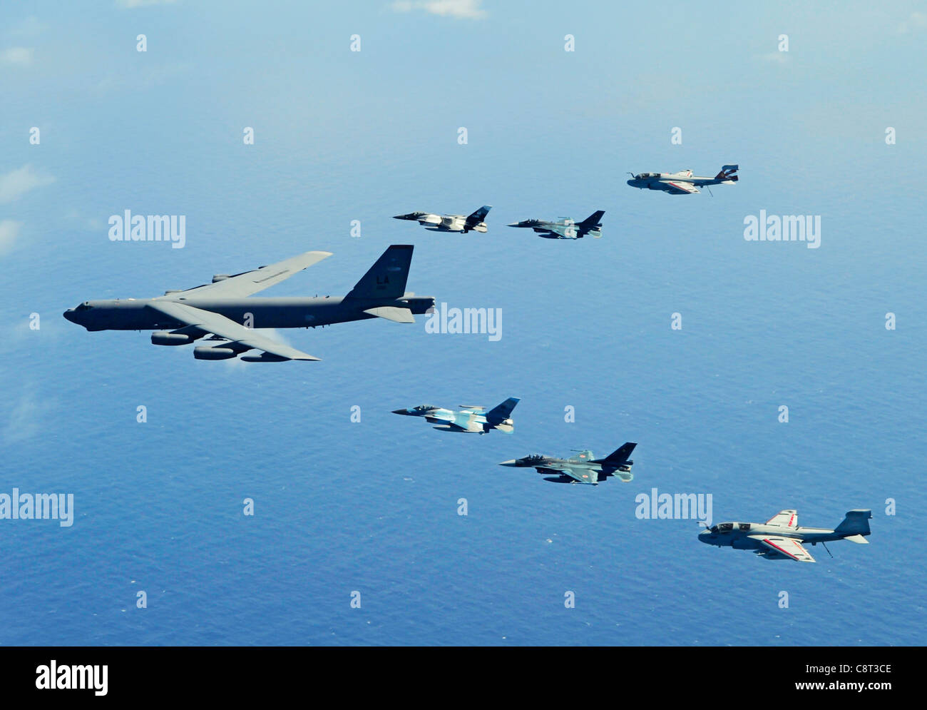 A B-52 Stratofortress leads a formation of two F-16 Fighting Falcons; two Japan Air Self-Defense Force F-2 attack fighters and two U.S. Navy EA-6B Prowlers Feb. 15, 2010 near Guam during Exercise Cope North. Stock Photo