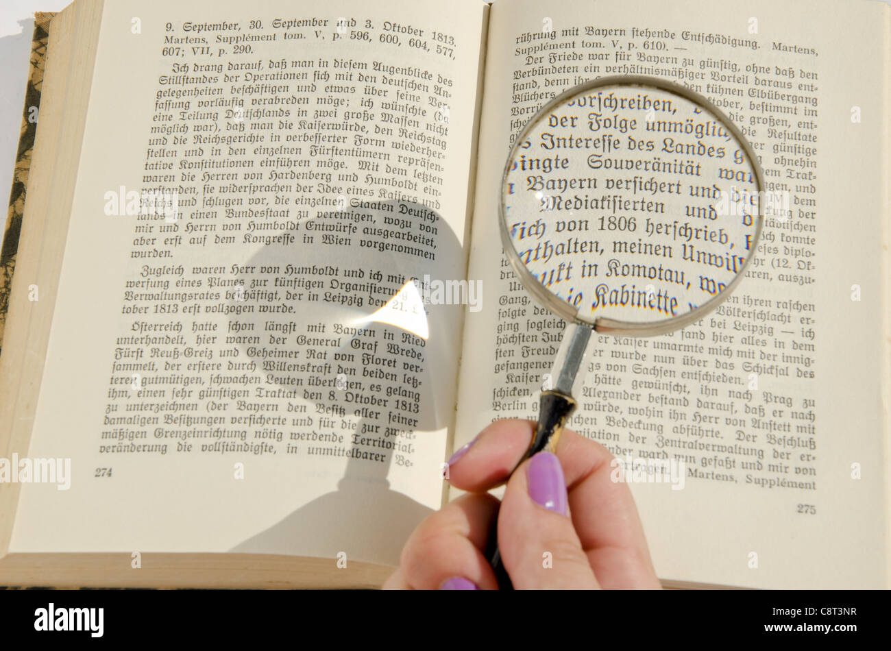 Magnifying glass over ancient hi-res stock photography and images - Alamy