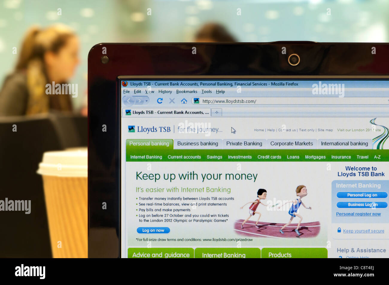 The Lloyds TSB website shot in a coffee shop environment (Editorial use only: print, TV, e-book and editorial website). Stock Photo
