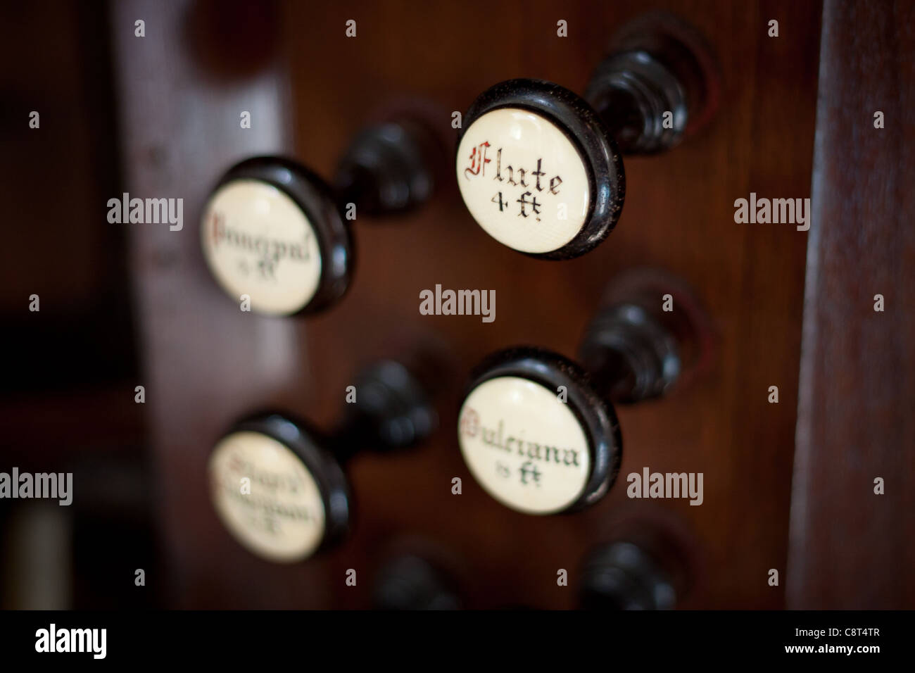 A pipe organs keyboard which is a religious instrument used in a Church to play Christian hymns