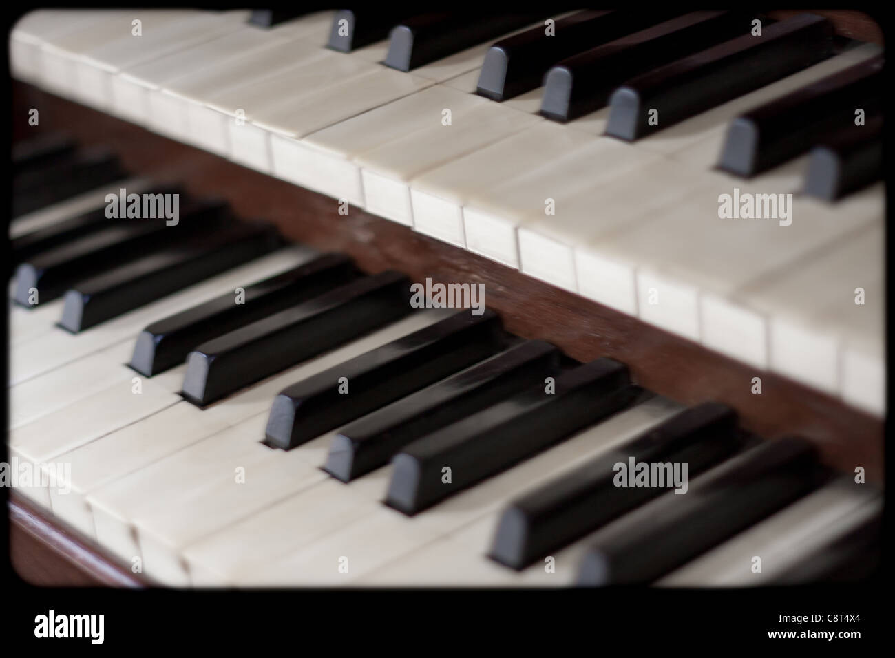 A pipe organs keyboard which is a religious instrument used in a Church to play Christian hymns