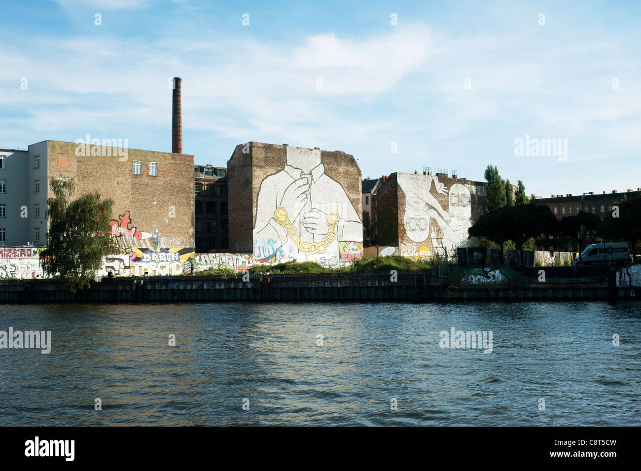 gaffiti of the street artist Blu on the river Spree in Berlin Stock Photo