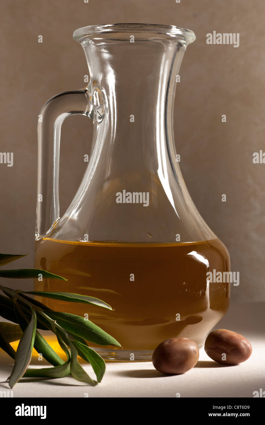Oil Cruet with Olives and Branch Stock Photo Alamy