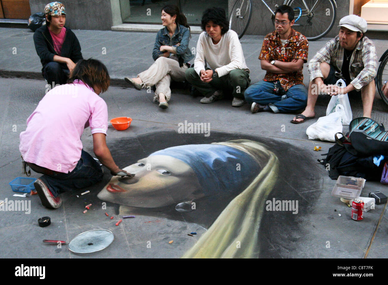 Street artist in Florence, Italy, drawing 'The Girl with a Pearl Earring' Stock Photo