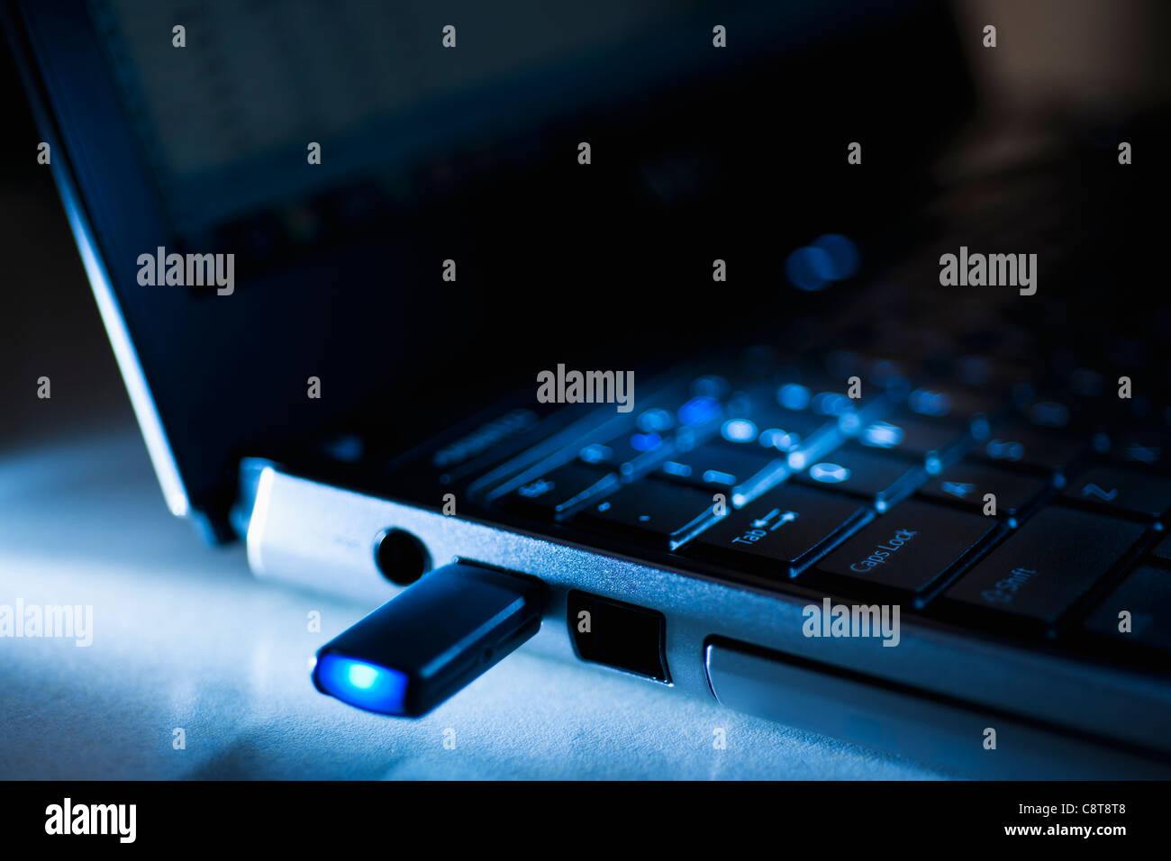 Studio shot of flash drive in laptop Stock Photo - Alamy