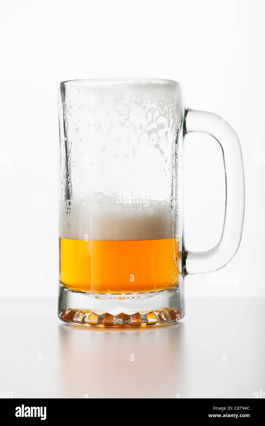 Studio shot of halffull beer glass Stock Photo Alamy