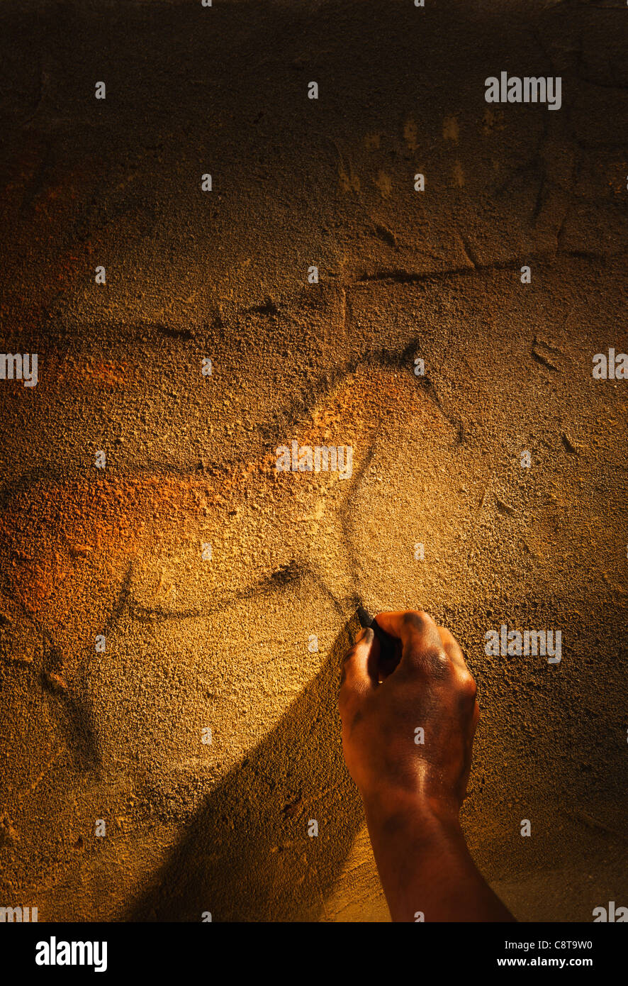 Studio shot of hand making cave painting of horse Stock Photo