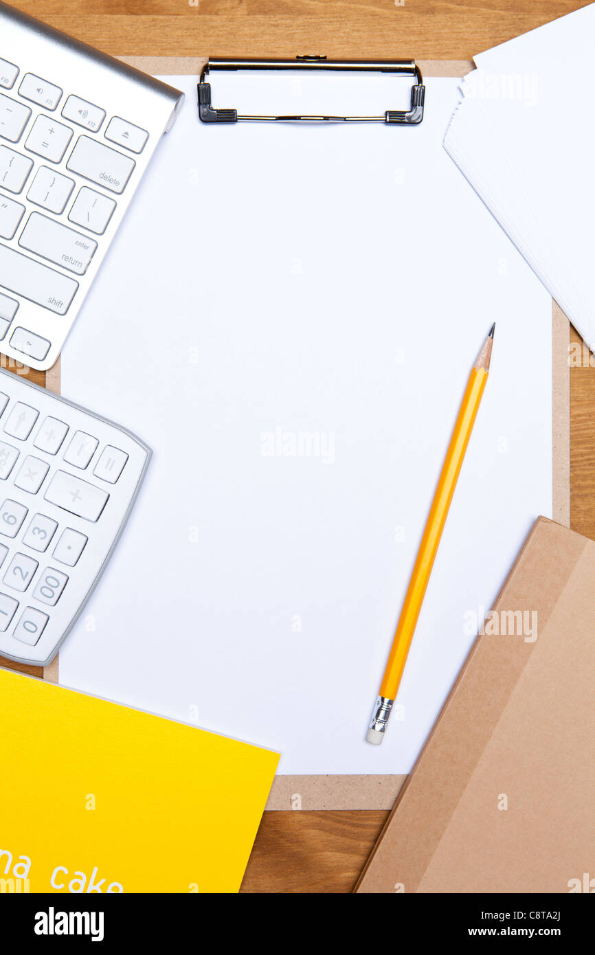 Pencil On A Pad With Keyboard And Calculator Stock Photo