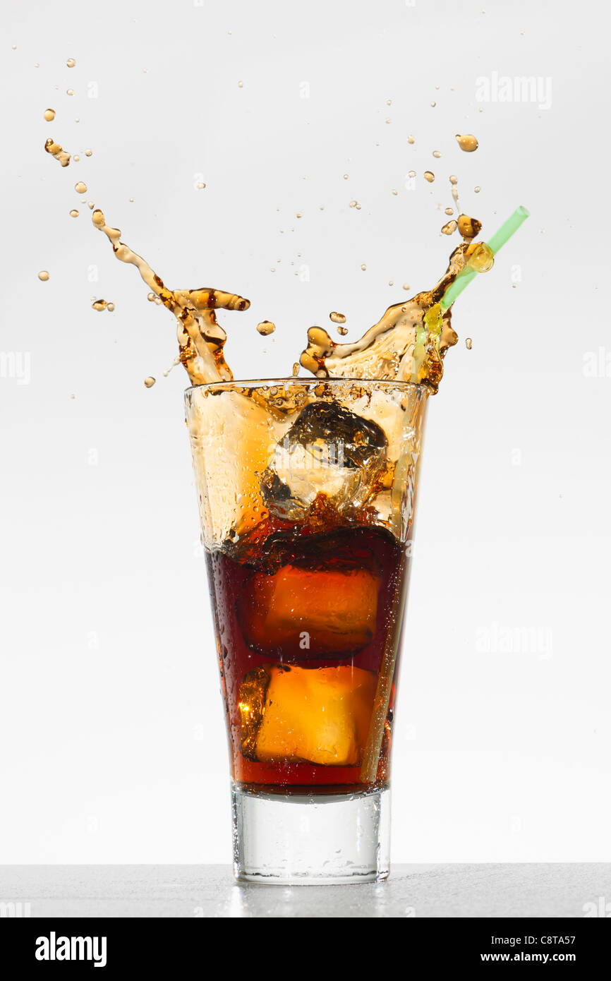 Studio shot of soda with splash Stock Photo Alamy