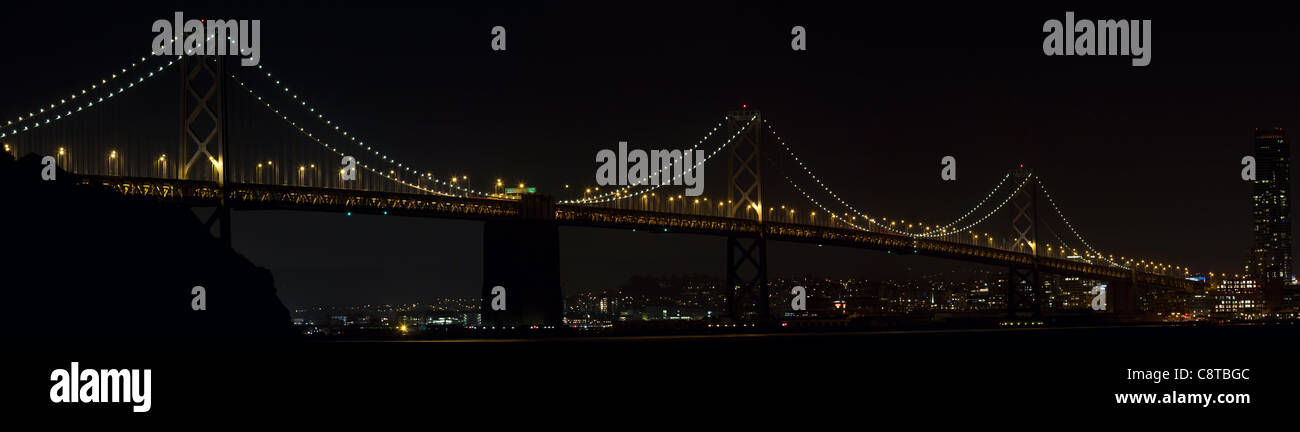 Oakland Bay Bridge Over San Francisco Bay in California at Night Panorama Stock Photo