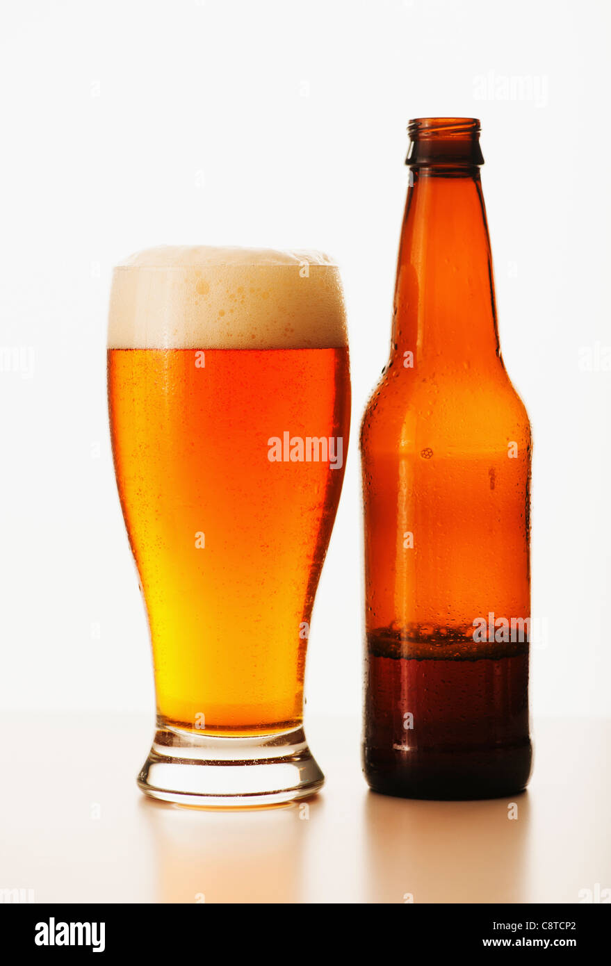 Studio shot of bitter ale in bottle and glass Stock Photo