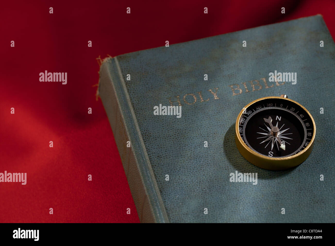 Compass on Holy bible Stock Photo Alamy