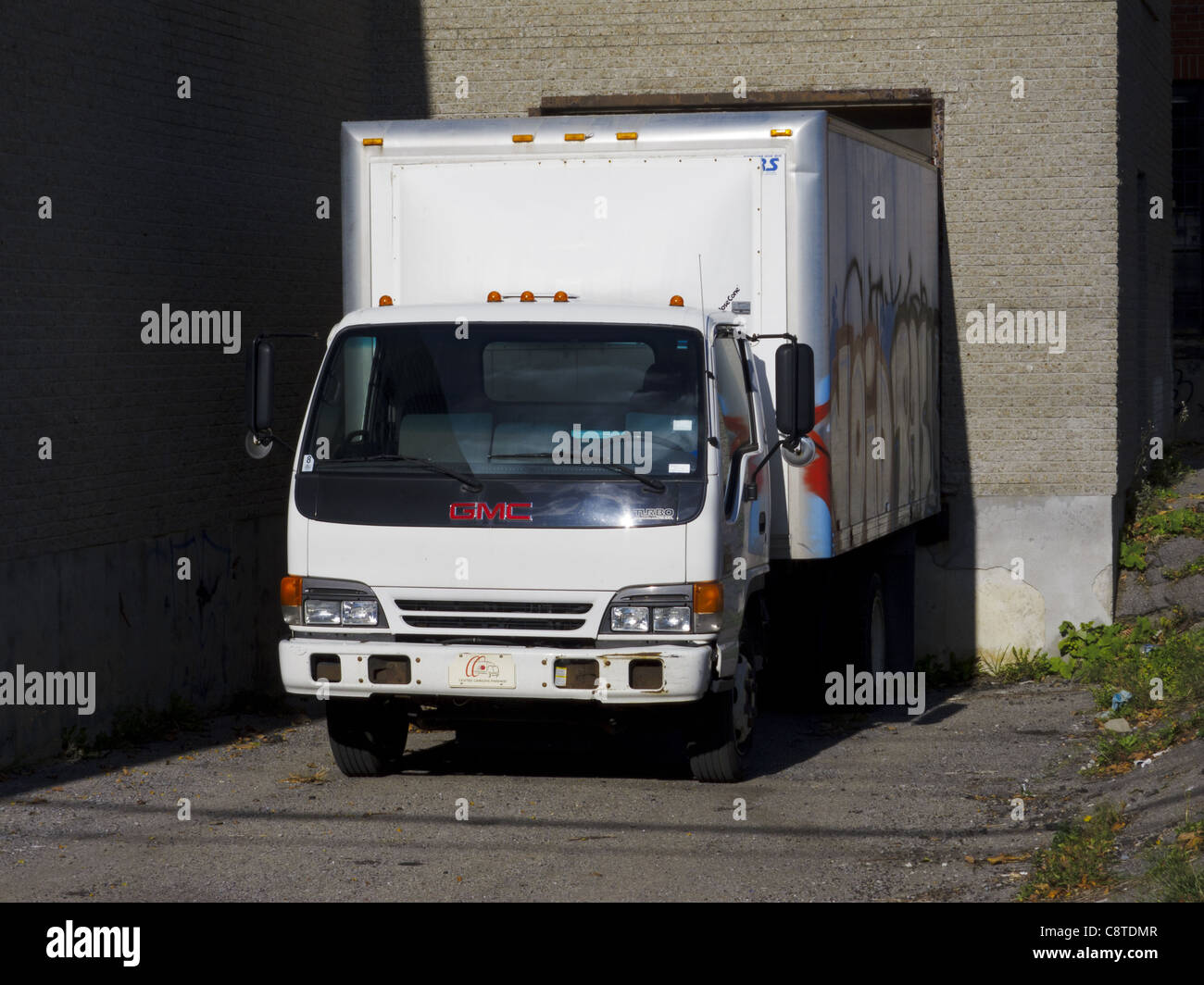 Small GMC truck in a loading bay Stock Photo