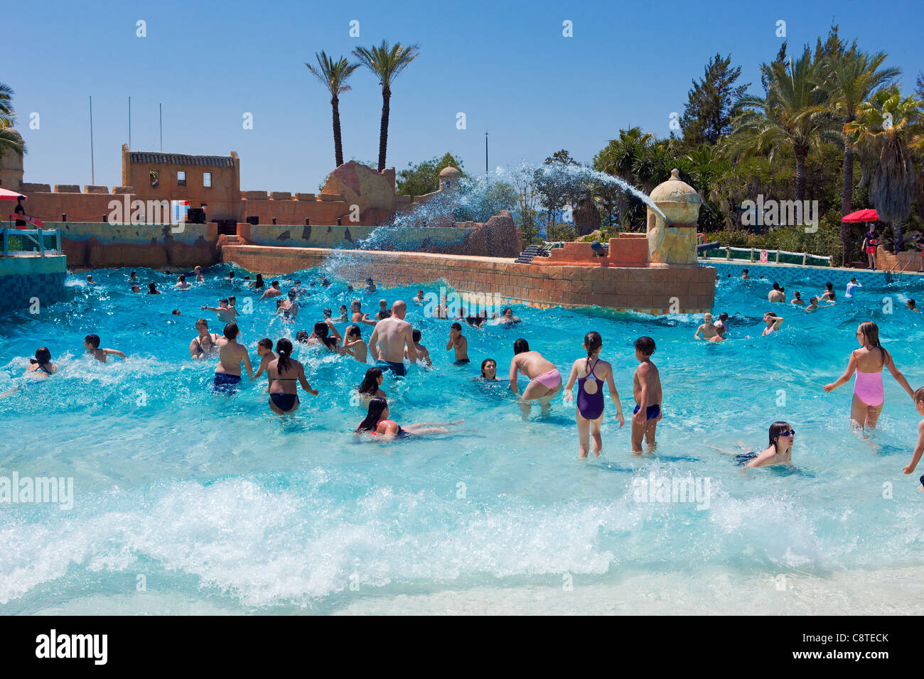 People bathing in a wave pool in Port Aventura Aquatic Park. Salou, Catalonia, Spain. Stock Photo