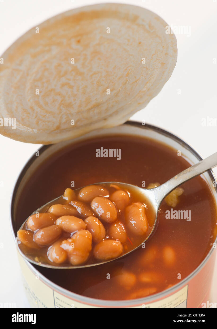 Close up of canned baked beans on spoon Stock Photo