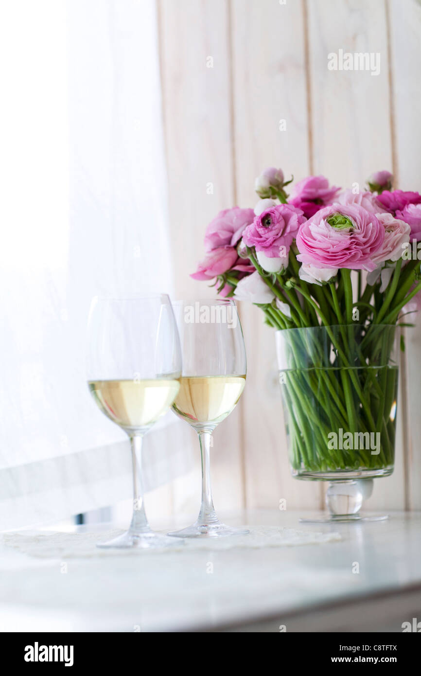 Close Up Of Wine Glasses With Flower Vase Stock Photo 39877290