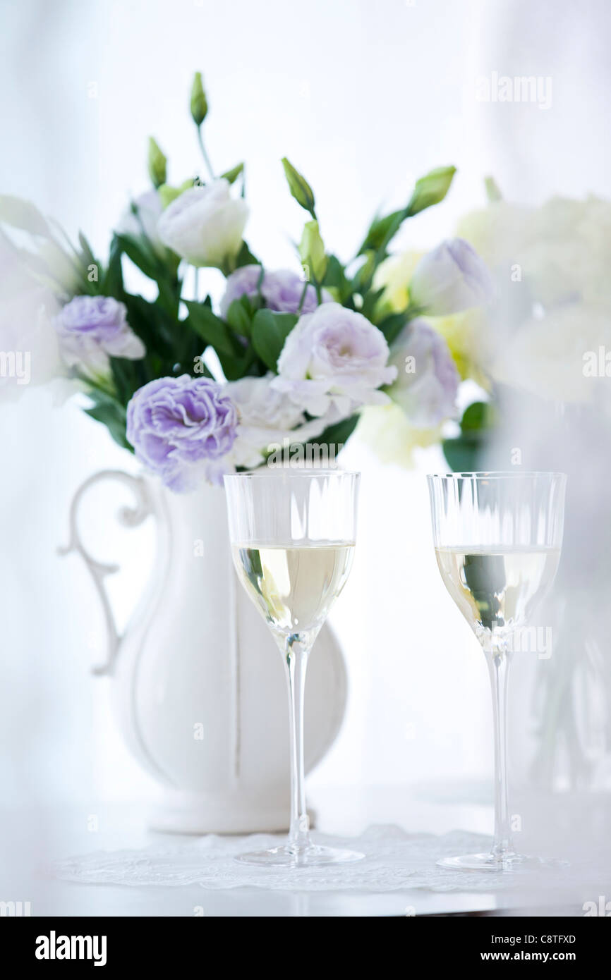 Close Up Of Wine Glasses With Flower Vase Stock Photo 39877333