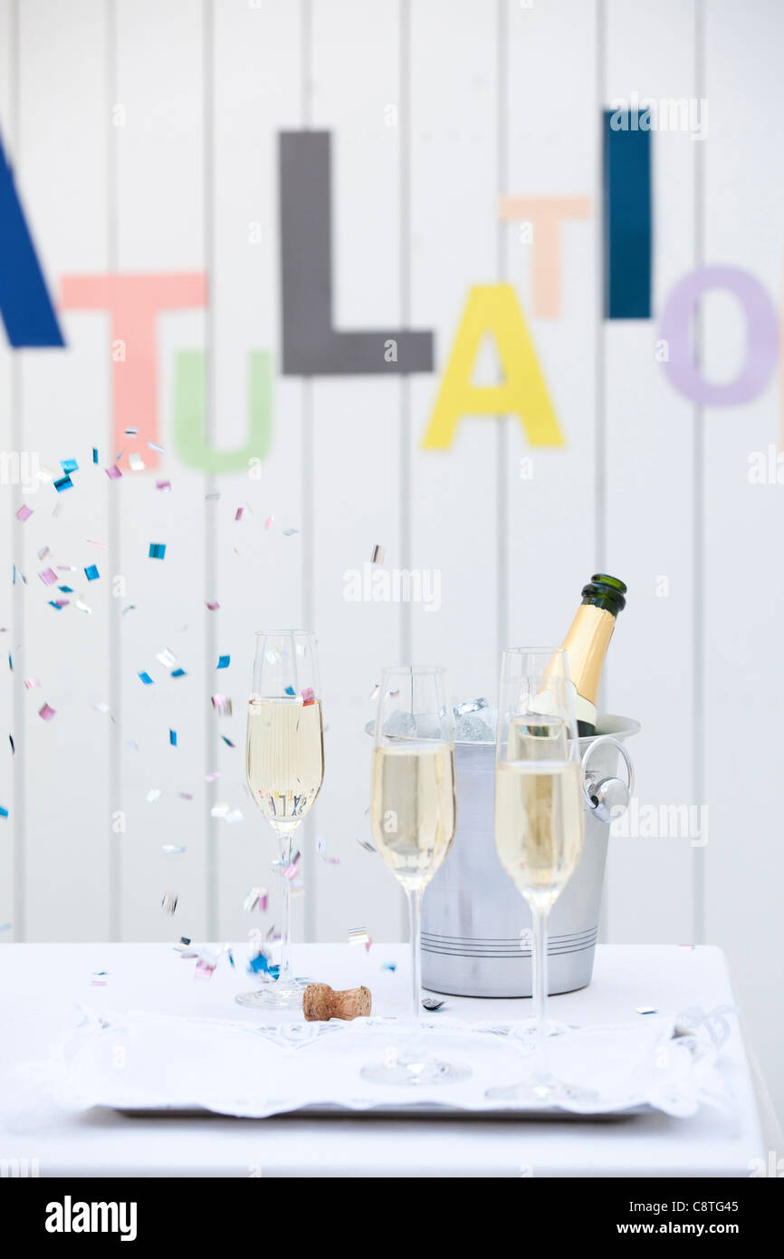 Confetti with wine glass during celebration Stock Photo Alamy