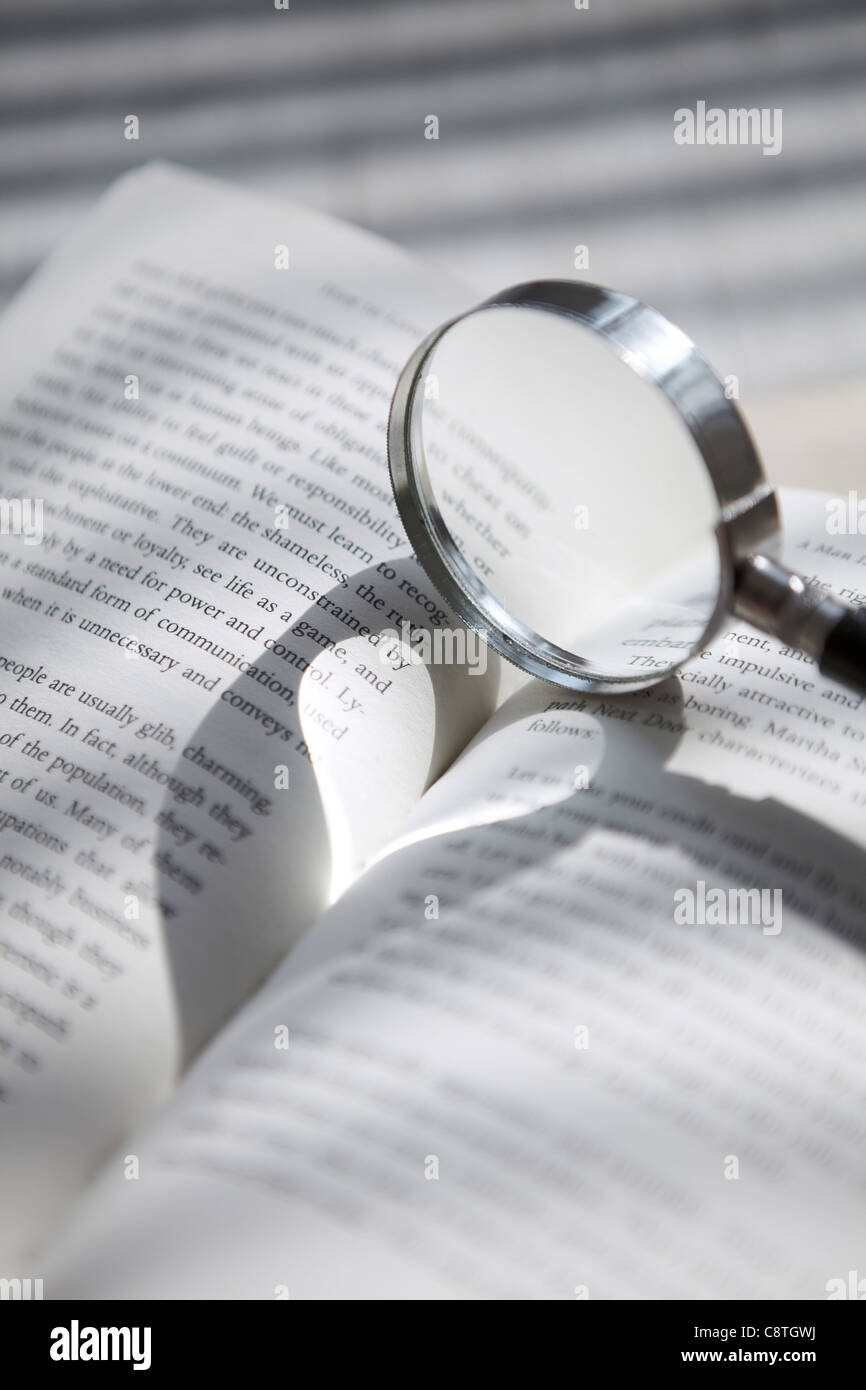 Book With Magnifying Glass Stock Photo Alamy