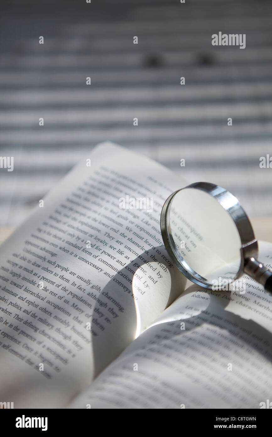 Book With Magnifying Glass Stock Photo Alamy