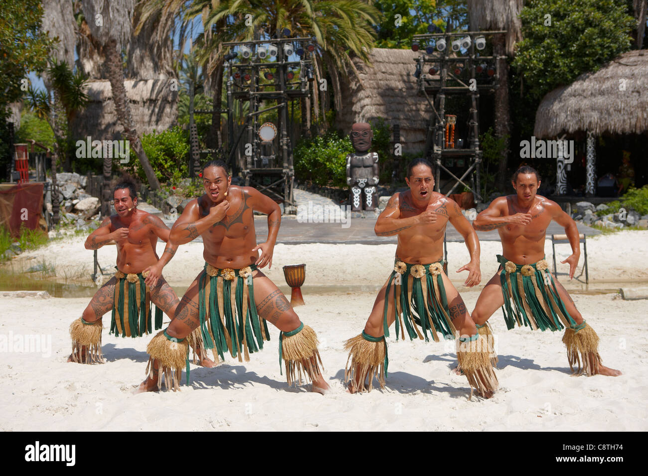 Polynesian dancers in traditional costumes perfom in Port Aventura amusement park. Salou, Catalonia, Spain. Stock Photo
