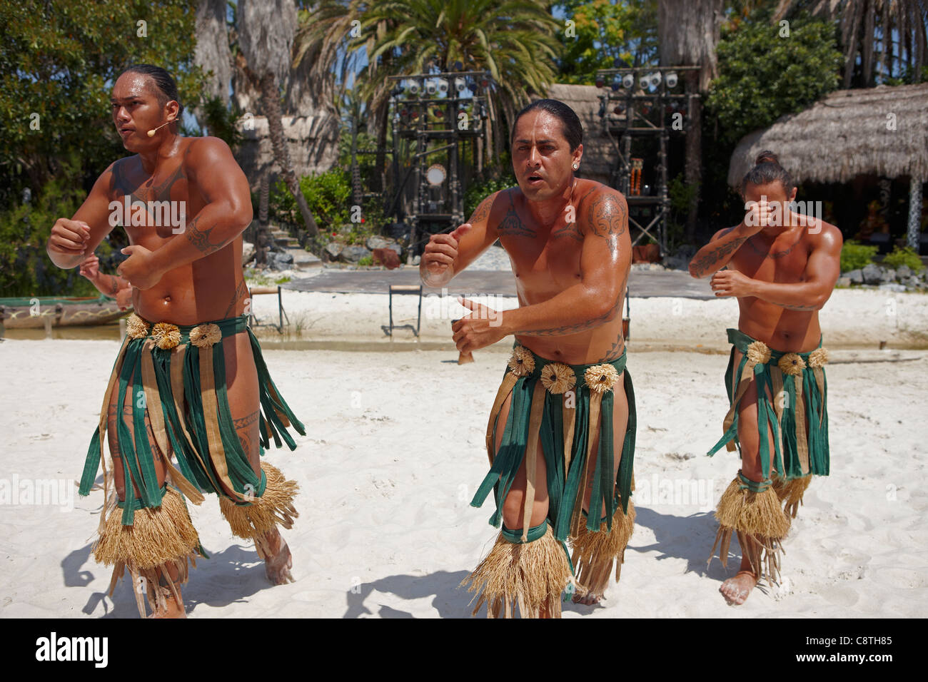 Polynesian dancers in traditional costumes perfom in Port Aventura amusement park. Salou, Catalonia, Spain. Stock Photo