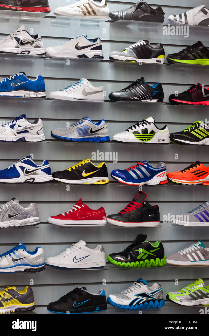 Shop window with colorful sport shoes. Stock Photo