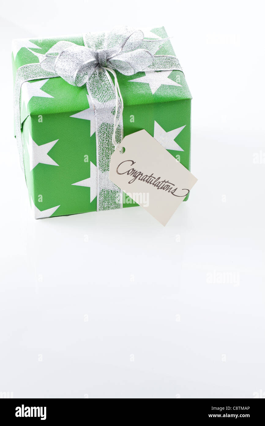 Gift Box With Congratulation Tag Stock Photo