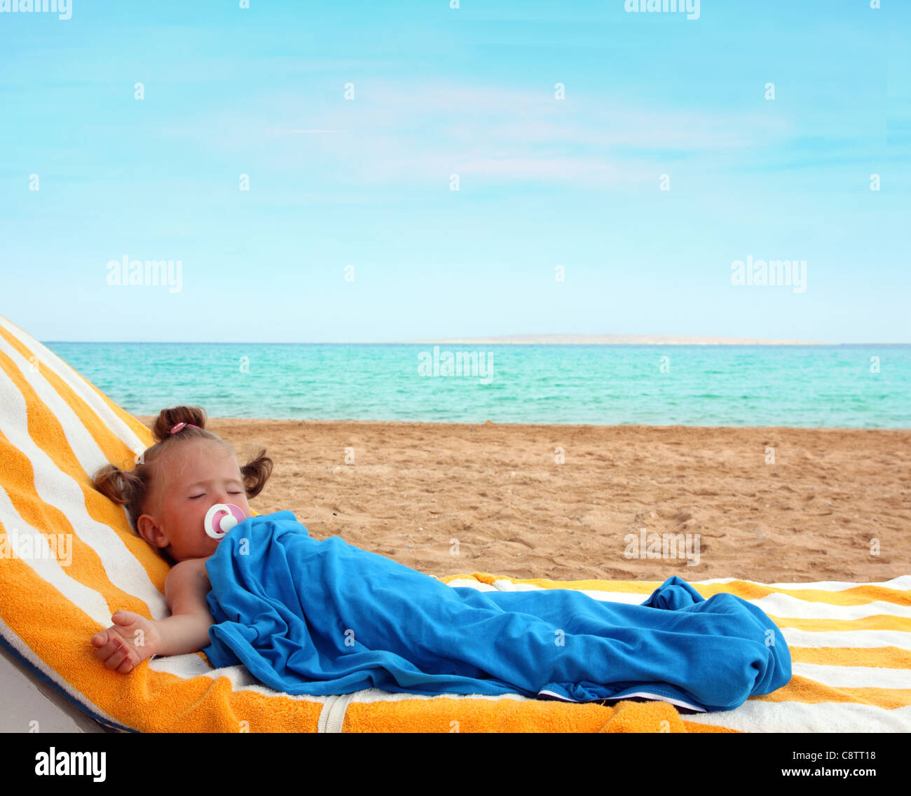 little girl sleeping on beach near sea Stock Photo Alamy