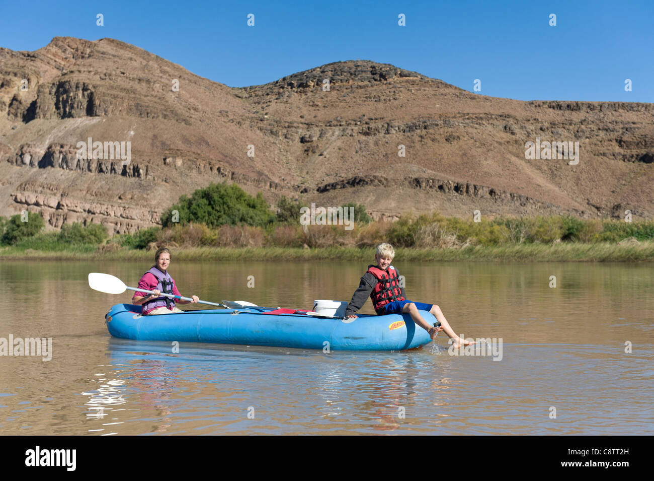 Mother and child enjoy  down the Oranje River at Noordoewer Namibia Stock Photo