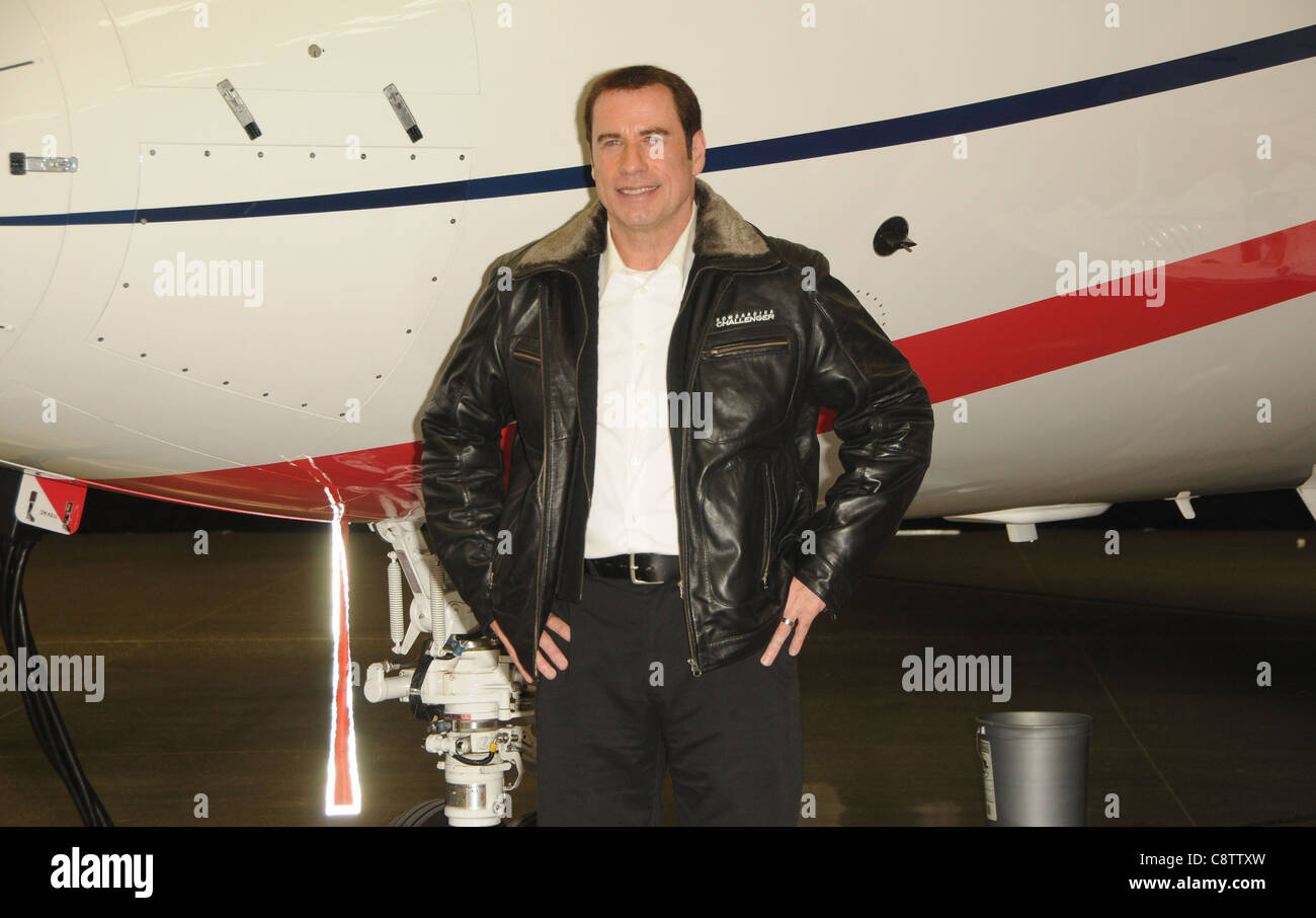 John Travolta at a public appearance for Bombardier Business Aircraft Jet Showcase, Hangar 25, Burbank, CA September 20, 2011. Stock Photo