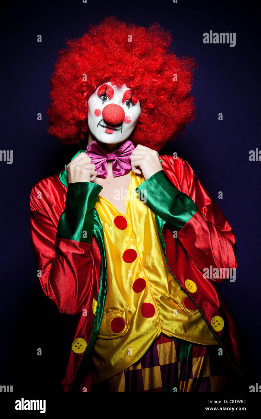 a female clown with colorful clothes and makeup Stock Photo - Alamy