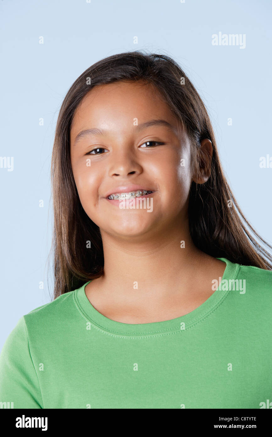 Studio portrait of girl smiling Stock Photo - Alamy