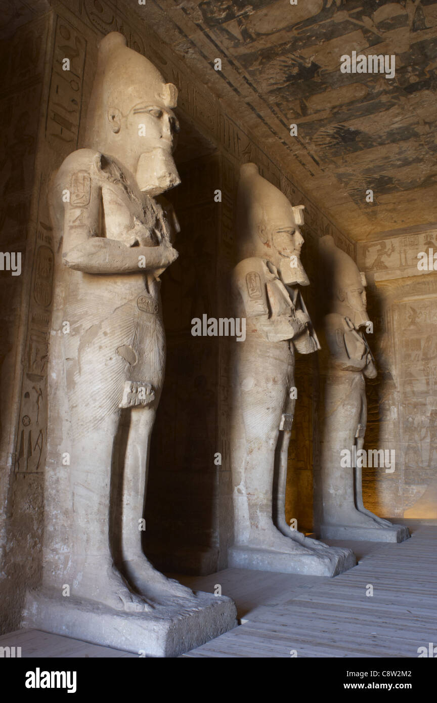 The God Ramsas Egyptian art. Great Temple of Ramses II. First room. Three statues of ...