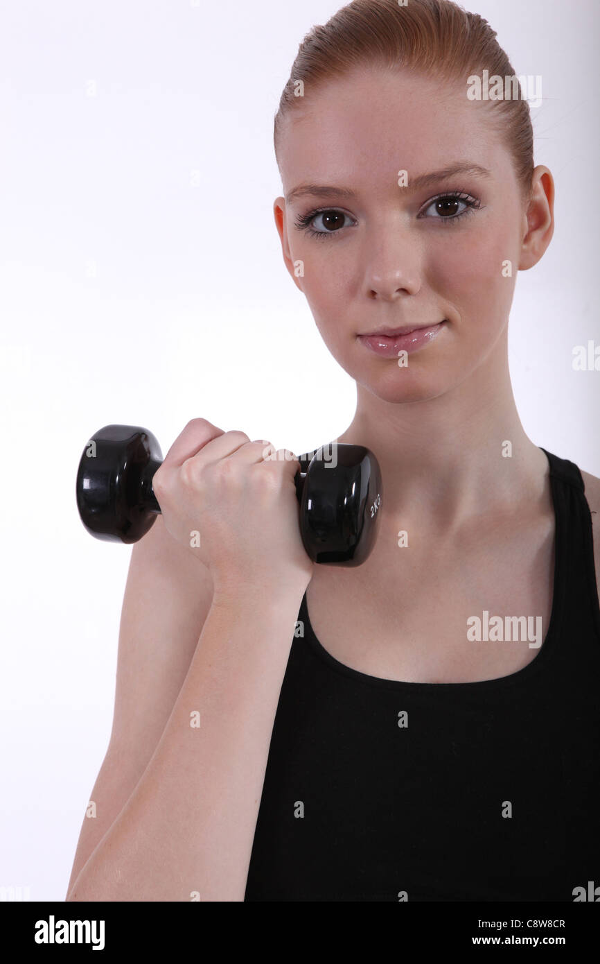 Gingerhaired girl in the gym Stock Photo Alamy