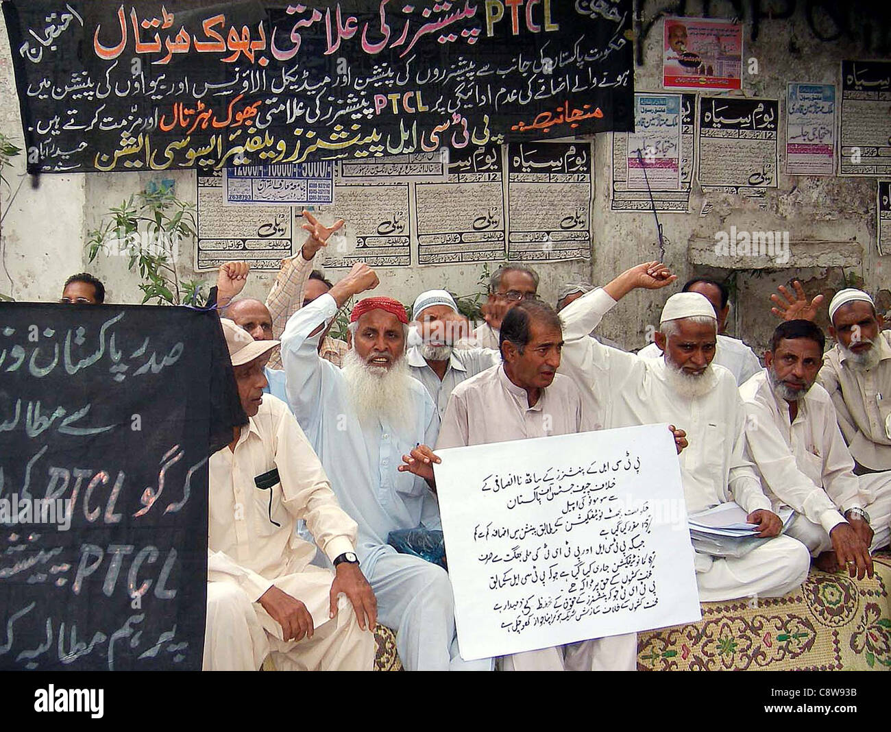 HYDERABAD, PAKISTAN, NOV 02: Telecommunication Company (PTCL) pensioners chant slogans in favor of their demands during demonstration in Hyderabad on Wednesday. Stock Photo