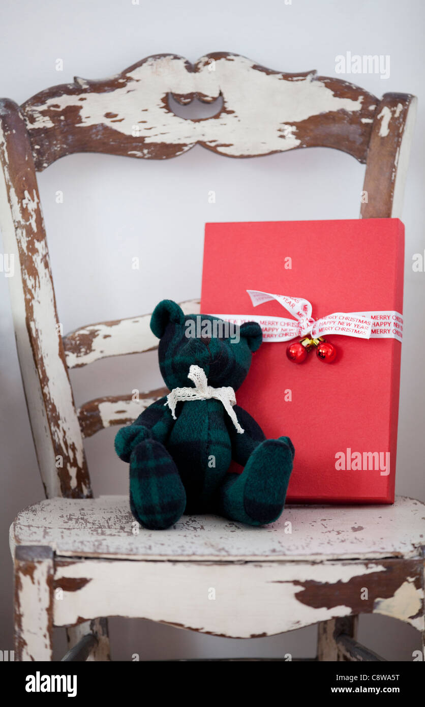 Christmas Gift Box And Teddy Bear On Rusty Chair Stock Photo - Alamy