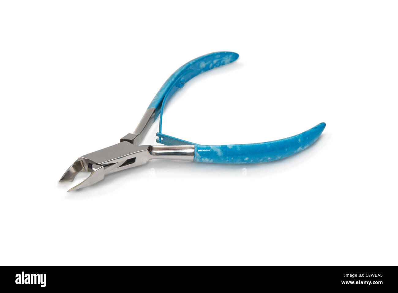 Metal manicure nippers with blue plastic handles. Stock Photo