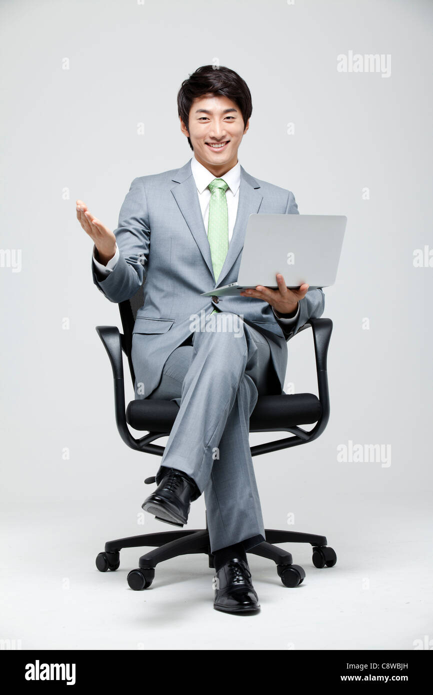 Man sitting on chair leg up hi-res stock photography and images - Alamy