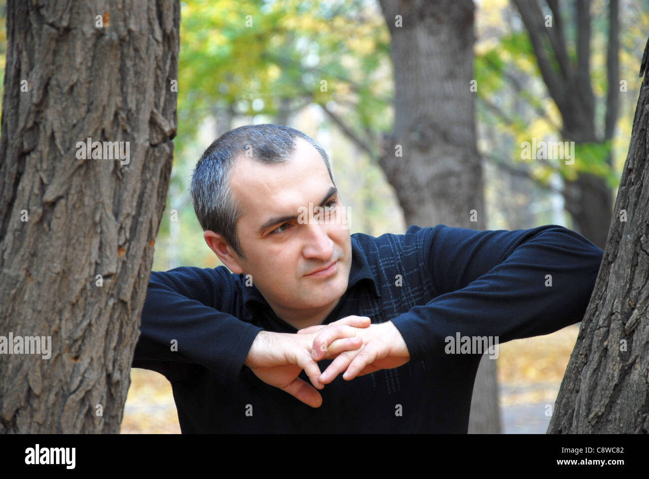 portrait of a man in the woods in autumn Stock Photo