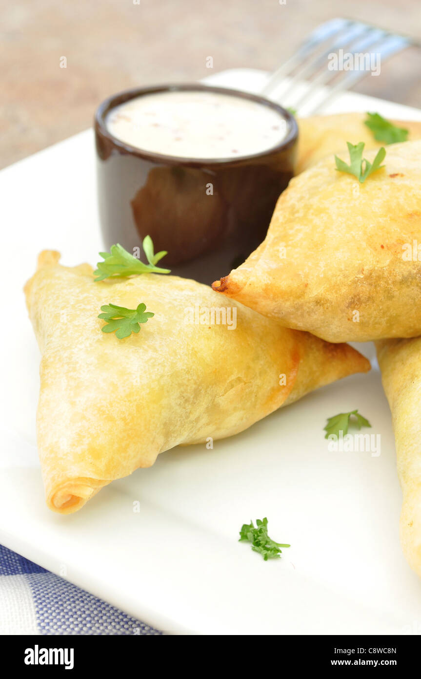 Mini feta and spinach phyllo triangles Stock Photo Alamy