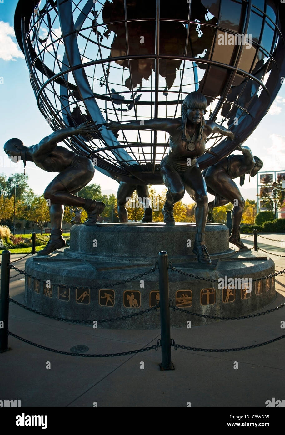 A back lit sculpture 'Olympic Strength' by Jon D. Hair in front of the U.S. Olympic Training Center, Colorado Springs, Colorado Stock Photo
